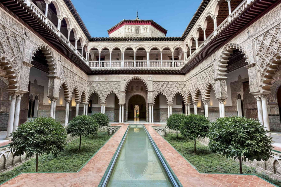 <p class="isSelectedEnd">The <strong><a href="https://www.getyourguide.nl/sevilla-l48/skip-the-line-ticket-koninklijk-alcazar-van-sevilla-t131232/?partner_id=GZ1KO7T&amp;utm_medium=travel_agent">Alc&aacute;zar of Seville</a></strong> is a royal palace complex that reflects a layered history of architectural styles, shaped by Islamic, Gothic and Renaissance influences. Originally developed as a Moorish fort, it evolved into a residence for Spanish royalty and remains in use today.</p>
<p class="isSelectedEnd">The site is known for its detailed tilework, geometric patterns and extensive gardens. Spaces such as the Patio de las Doncellas highlight the precision and craftsmanship of Mud&eacute;jar design, while later additions show how the structure adapted over time without losing its core identity.</p>
<p class="isSelectedEnd">Visitors move through a sequence of courtyards, halls and outdoor areas that demonstrate how political and cultural shifts influenced the building. The Alc&aacute;zar is not only a historical monument but also a working example of how architecture can carry multiple narratives across centuries.</p>
<p class="isSelectedEnd">Which historical site has given you the clearest sense of layered history? Share your perspective.</p>
<p>#artandculture #Spain #Seville #Architecture #Heritage #citybreak</p>