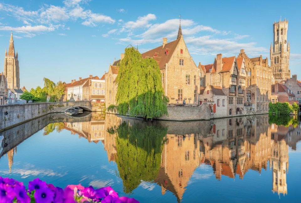 <h4 data-section-id="1jwpp1b" data-start="0" data-end="59">Experience Bruges Like a Local: Beyond the Tourist Crowds</h4>
<p data-start="61" data-end="359">Bruges is the crown jewel of West Flanders and one of Europe&rsquo;s most visited historic cities. Often called the &ldquo;Venice of the North,&rdquo; it attracts millions of tourists every year thanks to its medieval canals, cobblestone streets, and remarkably preserved architecture.</p>
<p data-start="361" data-end="582">But with popularity comes crowds &mdash; especially around the city&rsquo;s main squares, canals, and landmark museums. For those who want to experience the city differently, there are more authentic ways to discover its hidden side.</p>
<h3 data-section-id="1ydp8uk" data-start="584" data-end="617">Discover Bruges on two wheels</h3>
<p data-start="619" data-end="928">One of the most immersive ways to explore the city is through a guided <strong data-start="690" data-end="709">Retro Bike Tour</strong>, led by a local guide who takes you beyond the usual postcard spots. Instead of following the typical tourist routes, you cycle through quiet streets, hidden courtyards, and lesser-known corners of the historic center.</p>
<p data-start="930" data-end="1075">Along the way, the guide shares stories that bring Bruges&rsquo; layered history to life &mdash; from its medieval golden age to its modern cultural revival.</p>
<h3 data-section-id="c4aoi9" data-start="1077" data-end="1105">A taste of local secrets</h3>
<p data-start="1107" data-end="1361">The experience typically ends in a <strong data-start="1142" data-end="1167">hidden garden setting</strong>, away from the busy city center, where participants enjoy a small tasting of local products. It&rsquo;s a relaxed moment that contrasts sharply with the busy tourist hotspots just a few streets away.</p>
<p data-start="1363" data-end="1534">Before you leave, you also receive insider tips &mdash; almost like a local &ldquo;doggy bag&rdquo; of recommendations &mdash; helping you continue exploring Bruges beyond the obvious highlights.</p>
<h3 data-section-id="1ju8lls" data-start="1536" data-end="1576">A different way to see a famous city</h3>
<p data-start="1578" data-end="1844" data-is-last-node="" data-is-only-node="">While Bruges is undeniably one of Europe&rsquo;s most visited cities, experiences like these offer a more personal perspective. Instead of simply seeing the city, you get a feel for its rhythm, its quieter corners, and the everyday life that often gets lost in the crowds.</p>